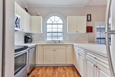 Kitchen with stainless steel appliances, backsplas