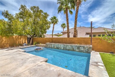 View of pool featuring a fenced backyard, a jacuzz