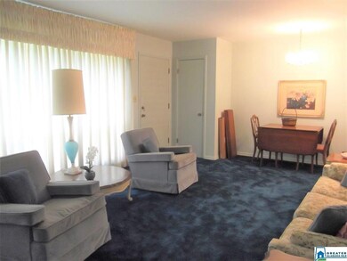The living room appears to have hardwood floors un