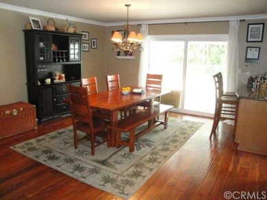 Dining room located off living room and kitchen.