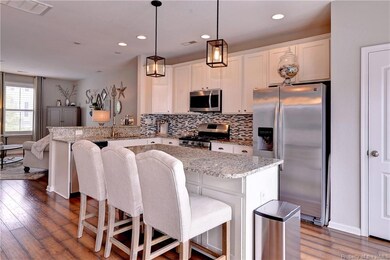 Custom seating island with granite top.