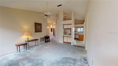 FAMILY ROOM LOOKING TOWARDS FRONT ENTRY, WET BAR A