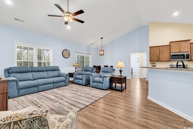 Living room with visible vents, a healthy amount o