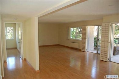 Huge living/dining room. Plantation shutters on wi