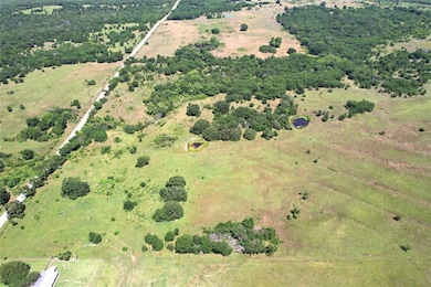 Birds eye view of property with a rural view