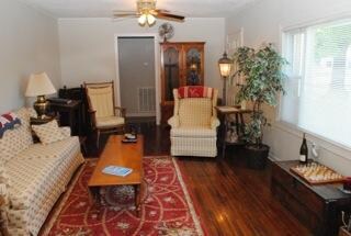 Hardwood flooring is featured in the formal living area, hall and bedrooms.