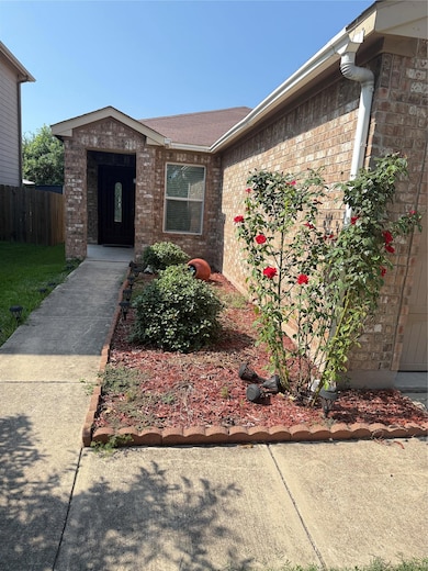 Doorway to property with brick siding