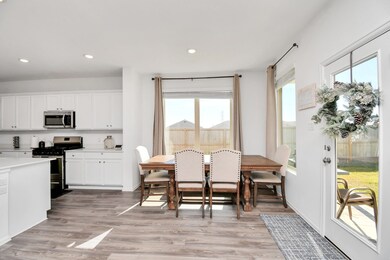 A spacious dining area that comfortably seats family and friends, with natural light seeing the beauty of the outside.