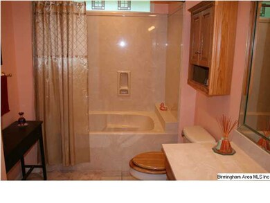 RENOVATED HALL BATHROOM FEATURES A GARDEN TUB AND 