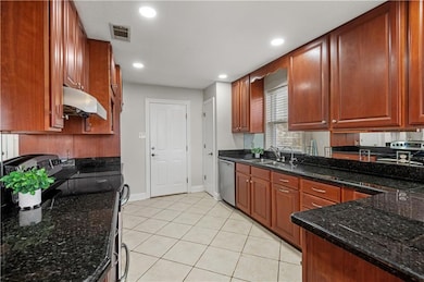 Open kitchen with door going to the breezeway and