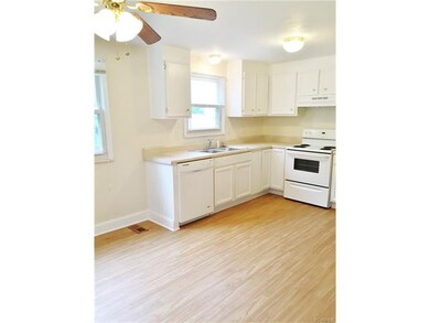 large bright kitchen with ceiling fan
