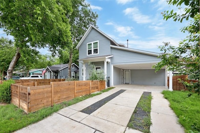 View of front facade featuring concrete driveway 