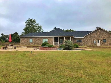 Back of home with pool area