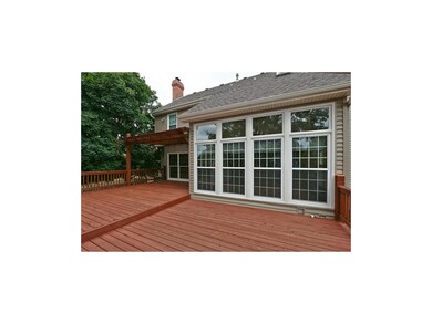 The back of the home is a wall of windows overlook