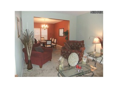 The formal living room is located to the right of 