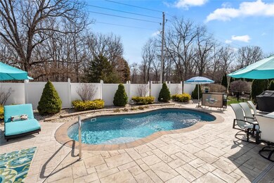Beautiful heated salt water pool!  NOTE:  white vinyl panels have been removed per HOA request.