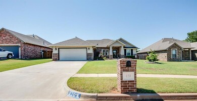 View of front facade featuring a garage and a front yard