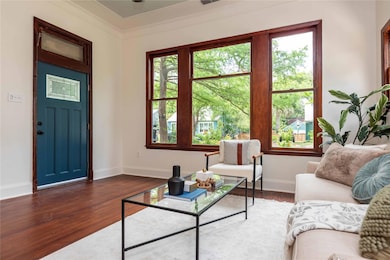 Living area with baseboards and a healthy amount 