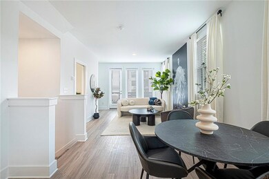 Dining space featuring plenty of natural light and light hardwood / wood-style flooring