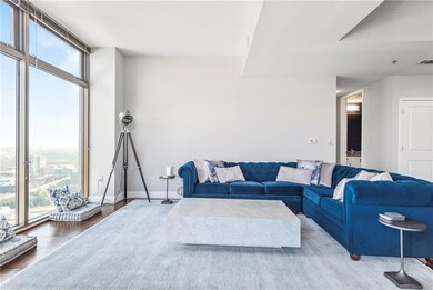 Living area with wood finished floors, baseboards,