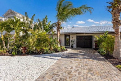 New paved driveway and custom impact garage door