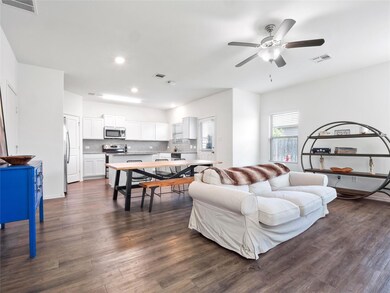 Living area featuring dark wood-type flooring, re