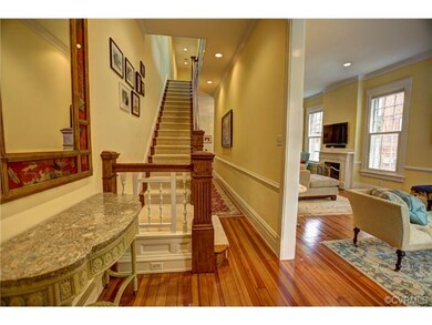 Inviting foyer is lit with recessed lighting and s