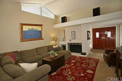 Living room with vaulted ceilings, fireplace & neu