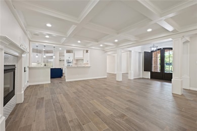 Unfurnished living room featuring a tile fireplace