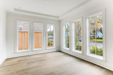 Light & bright library excludes elegance with gleaming hardwoods and high ceilings. Notice the beautiful windows that overlook the front garden as well as provide ample natural light throughout.