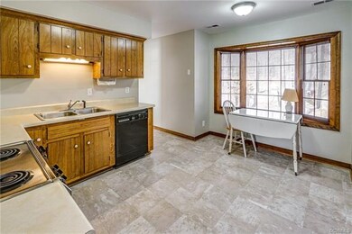 Nice size kitchen with new floor and eat-in area
