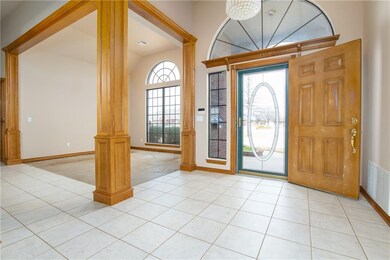 Large entry with formal dining, facing front of ho