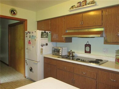 There's an electric wall oven, electric cooktop an