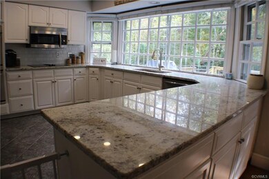 Renovated white bright kitchen w/ granite counters