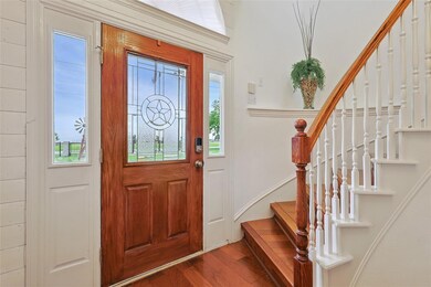 Entrance foyer featuring wood-type flooring