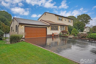 Two car garage and double wide paved driveway