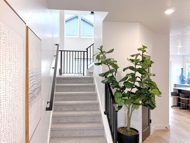 Staircase featuring wood finished floors and recessed lighting