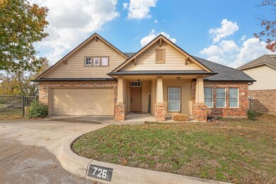 Craftsman-style house with a front yard and covere