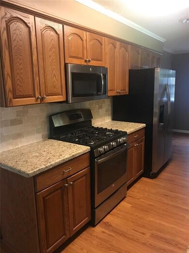 Opposite side of kitchen has 5 burner sealed gas r