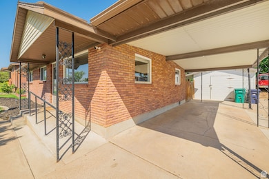 View of patio / terrace featuring a shed