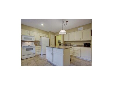 Beautiful kitchen island with quartz countertop an