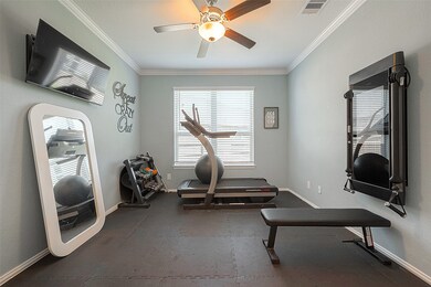 Just off the entry is this spacious home office. Currently being used as a workout room.