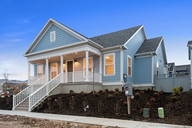 View of front facade with covered porch, roof with shingles, and stairway