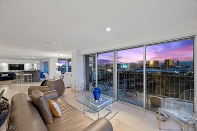 Living area with tile patterned floors and recessed lighting