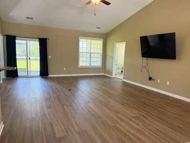 Unfurnished living room with baseboards, ceiling f