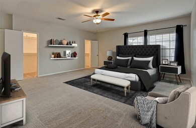 Primary bedroom offers room for a desk or sitting