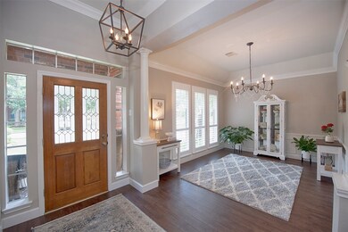 A view of the foyer entry with wonderful high ceilings as you are greeted by the formal dining room.