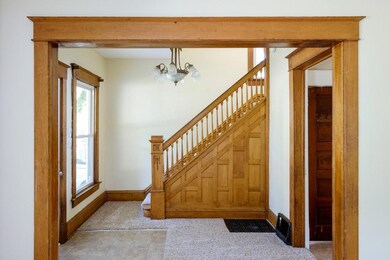 beautiful banister inside front door