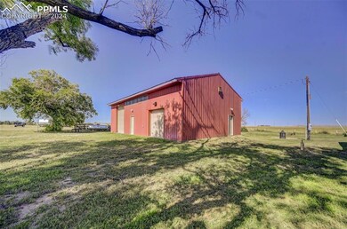 View of outdoor structure featuring a rural view a