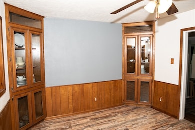 Empty room with a wainscoted wall, wooden walls, w